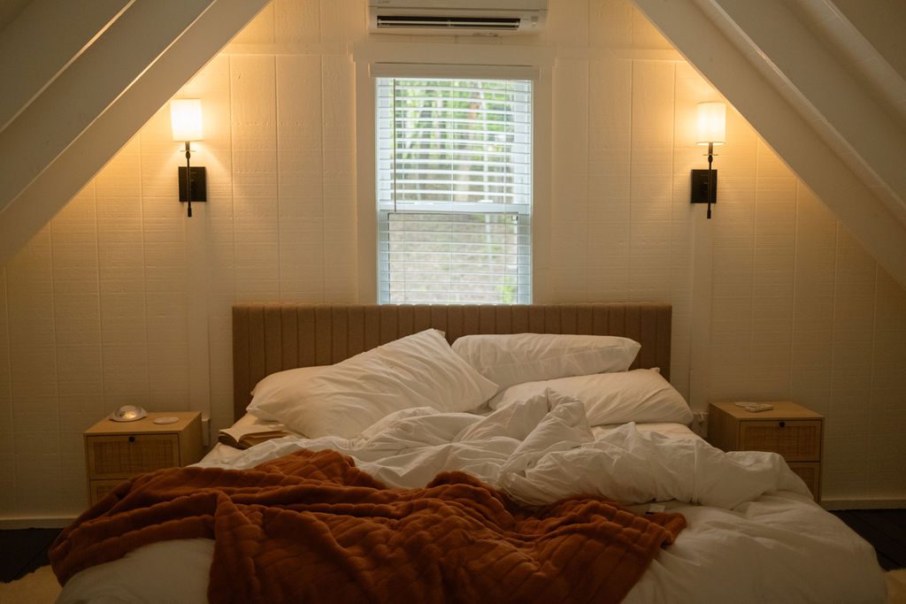 A quiet, staged bedroom at a Notestone Reserve stay in Hocking Hills, Ohio